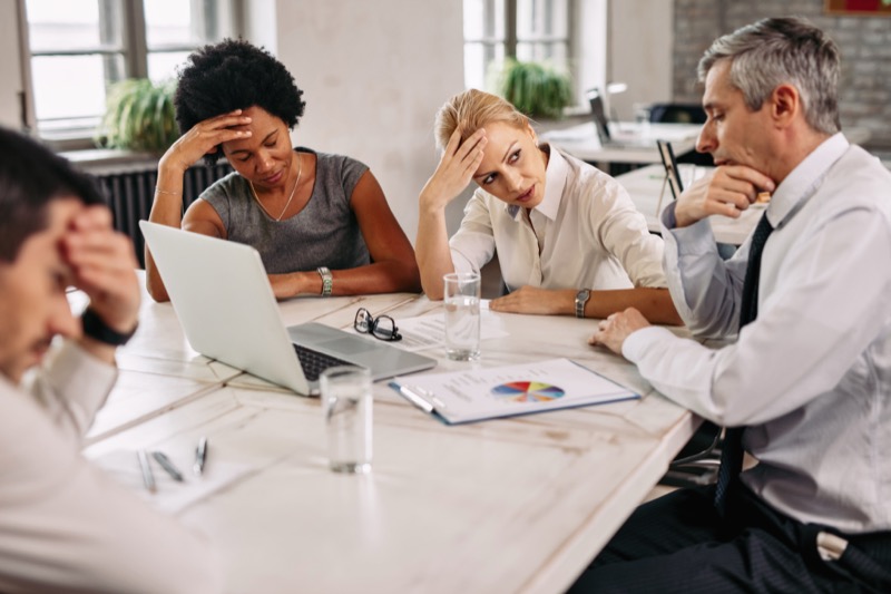 Business team frustrated with outdated portfolio tracking