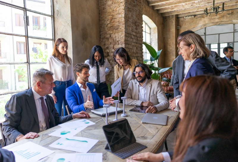 Investment professionals discussing portfolio strategy